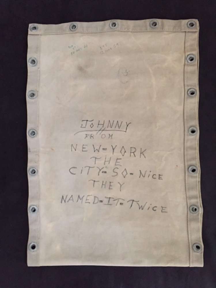 c28c34e473-johnny-from-new-york-the-city-so-nice-they-named-it-twice-jpg.jpeg Canvas with graffiti from the USNS General Nelson M. Walker. Courtesy of Art and Lee Beltrone, Vietnam Graffiti Project, Keswick, VA<br/>