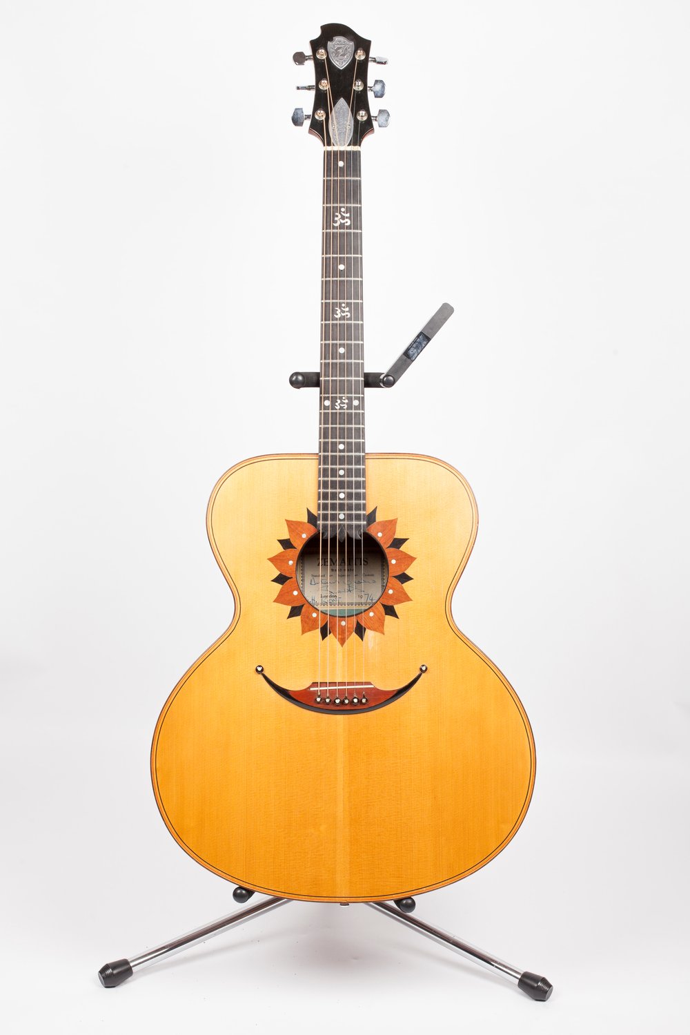 c5555651flotus-6-string_george-harrison-jpg.jpeg George Harrison's commissioned this “Lotus” acoustic, which features a Jumbo-size body with flower petal-shaped wooden inlays around the soundhole. Harrison ordered this six-string model as well as a twelve string version and used them extensively for his solo work in the latter half of the 1970s.