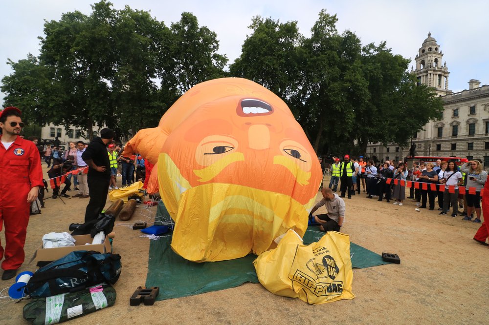 c708b9bbdshutterstock_9760864o-jpg.jpeg An 18 foot tall Trump Big Baby inflatable Blimp is installed in Parliament Square to protest against the UK visit of President Trump on July 13, 2018 (Amer Ghazzal/Shutterstock)