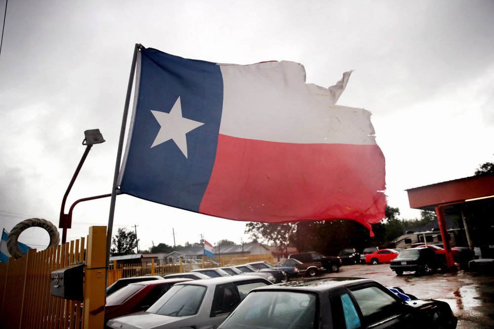 c73e30557gettyimages-839591270-jpg.jpeg Wind from Hurricane Harvey batters a Texas flag on August 26, 2017 in Houston, Texas<br>