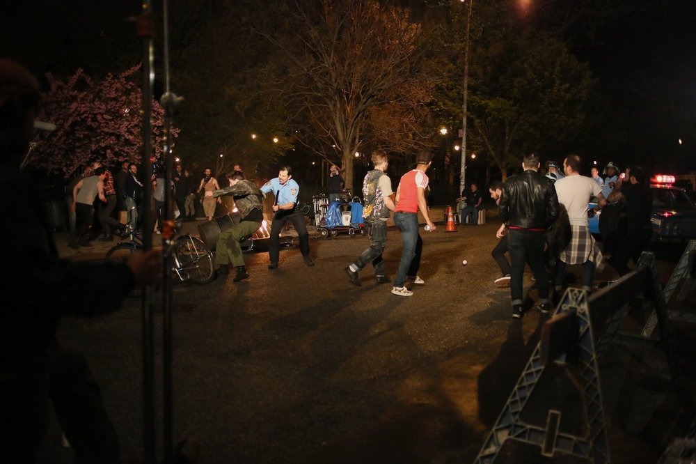 c9f3db947.jpeg A stunt bicyclist is knocked to the ground by police in the melee.<br/>