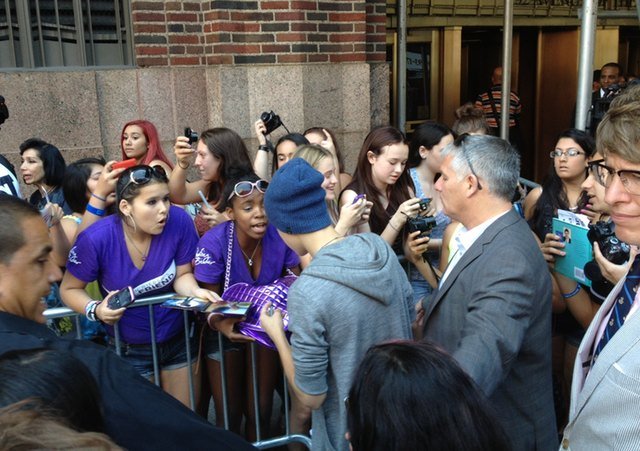 Hipster Cop with Justin Bieber, redux. (Photo by Tien Mao/Gothamist)