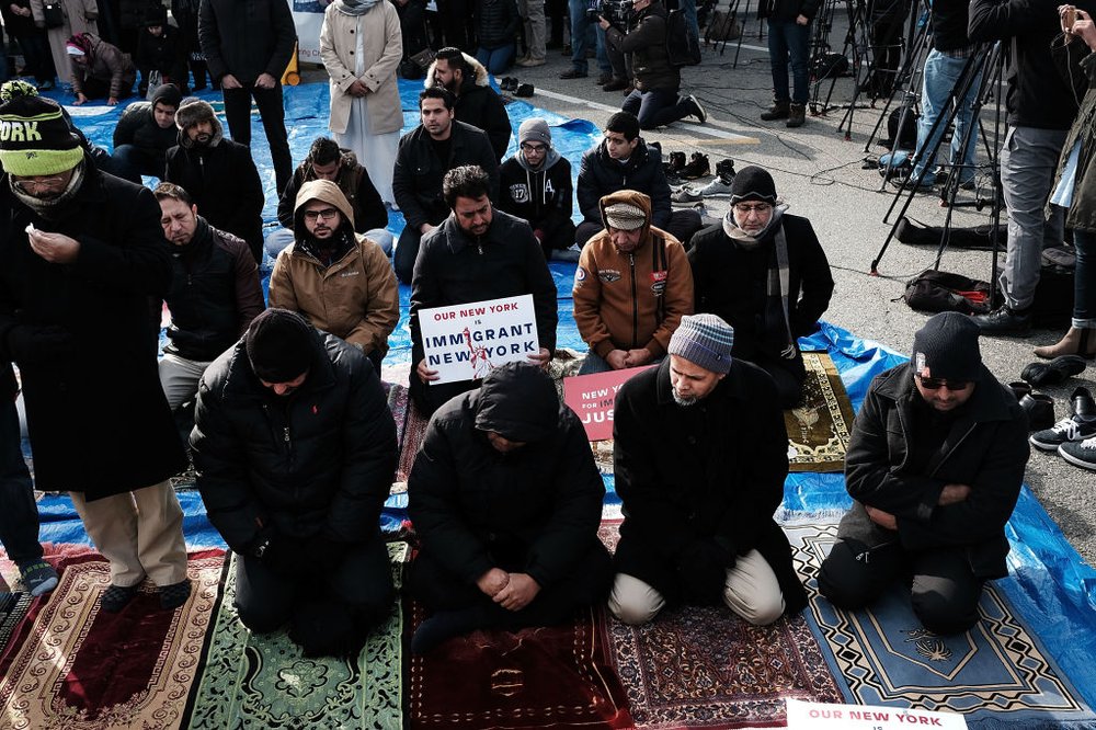ce3ea1620gettyimages-633701154-jpg.jpeg Muslim men pray at a prayer and demonstration at JFK airport to protest President Donald Trump's immigration ban, February 3, 2017 <br>