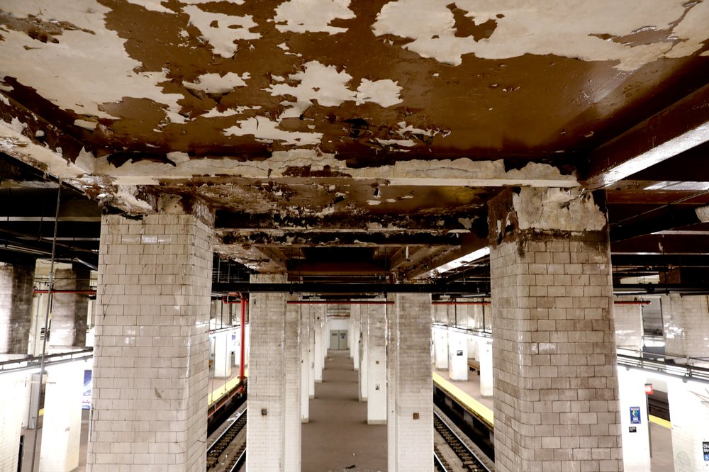 A photo of a dingy, dilapidated ceiling at the Chambers Street station