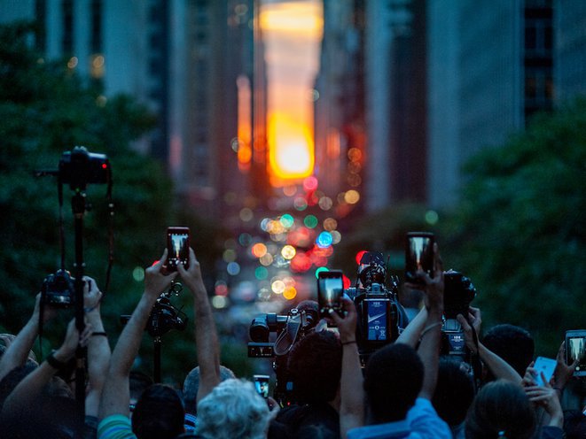 Manhattahenge with a crowd taking photos