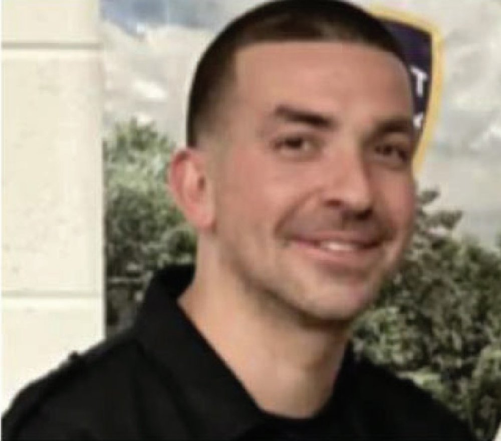 A headshot of a police officer.
