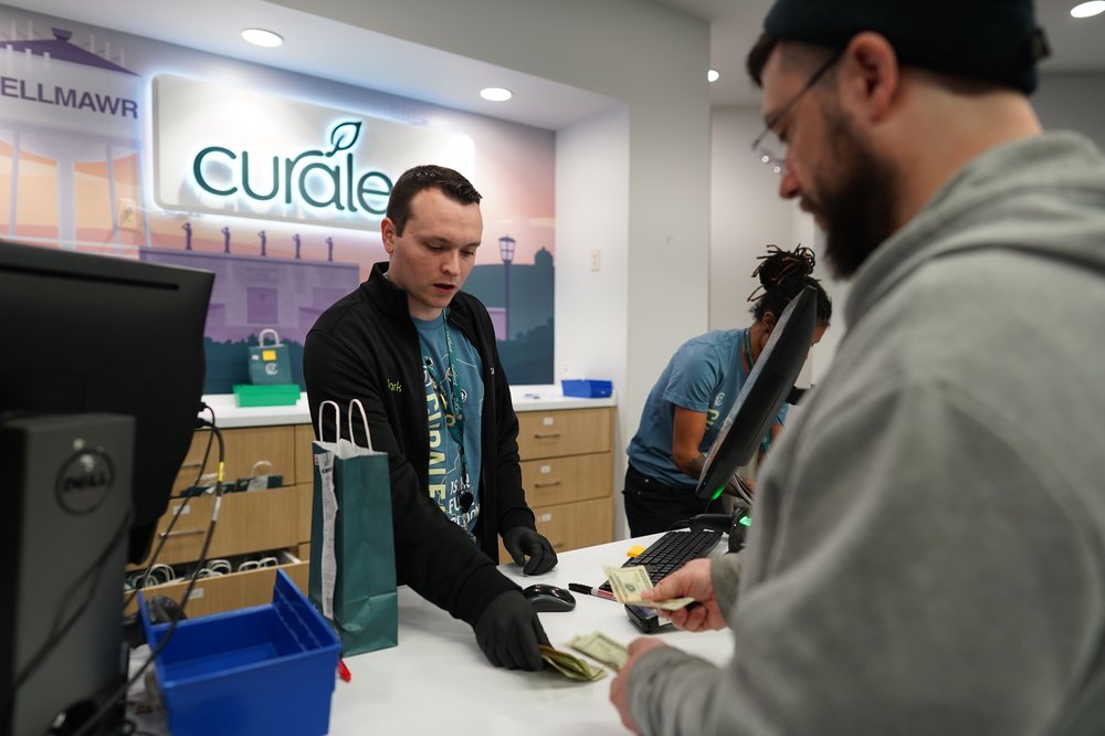 A customer purchases marijuana for recreational use at the Curaleaf dispensary in Bellmawr, New Jersey, April 21, 2022,