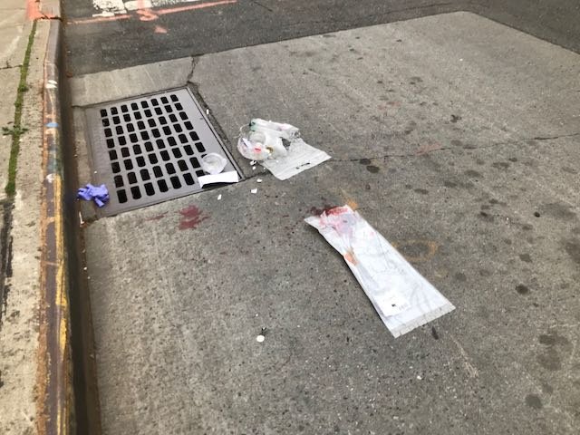 Bloody medical materials left in the street after Saturday's crash.