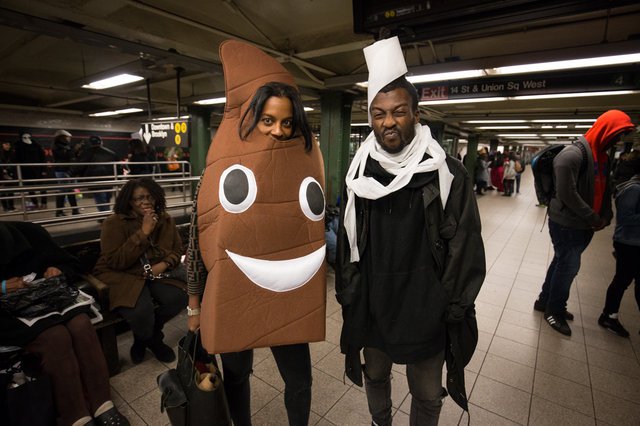 d11a2c54869e24d9abimg_3349-jpg-mobile-jpeg.jpeg Ignore the poop emoji on the left. The brilliant costume here belongs to the guy on the right with toilet paper all over his head. It's both a practical costume AND a good setup for someone to find their own poop emoji soulmate.