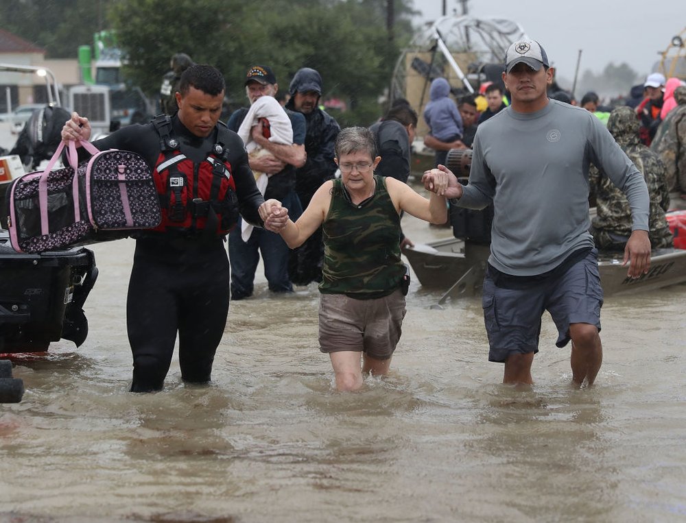 d46e075cfgettyimages-840331564-jpg.jpeg An evacuee is helped to dry land after her home was inundated with flooding from Hurricane Harvey on August 28, 2017 in Houston, Texas<br>