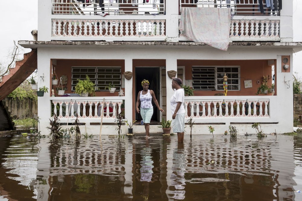 d9dd9b167092517gettypuertorico5-jpg.jpeg Residents wade through flood waters at their home days after Hurricane Maria made landfall, on Friday, September 22nd in Loiza, Puerto Rico. (Alex Wroblewski/Getty Images)