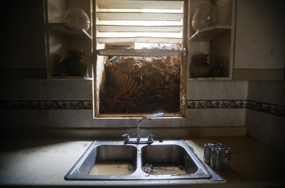 daa91f6d3gettyimages-859541688-jpg.jpeg Mud from a landslide blocks the kitchen window of the Reyes family more than two weeks after Hurricane Maria hit the island, on October 9, 2017 in Jayuya, Puerto Rico. <br/>