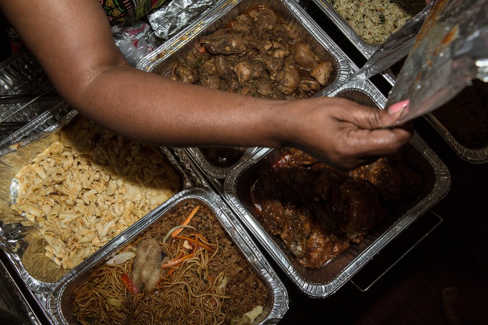 Noodles, chicken, and macaroni dishes at Carenage Mas camp.