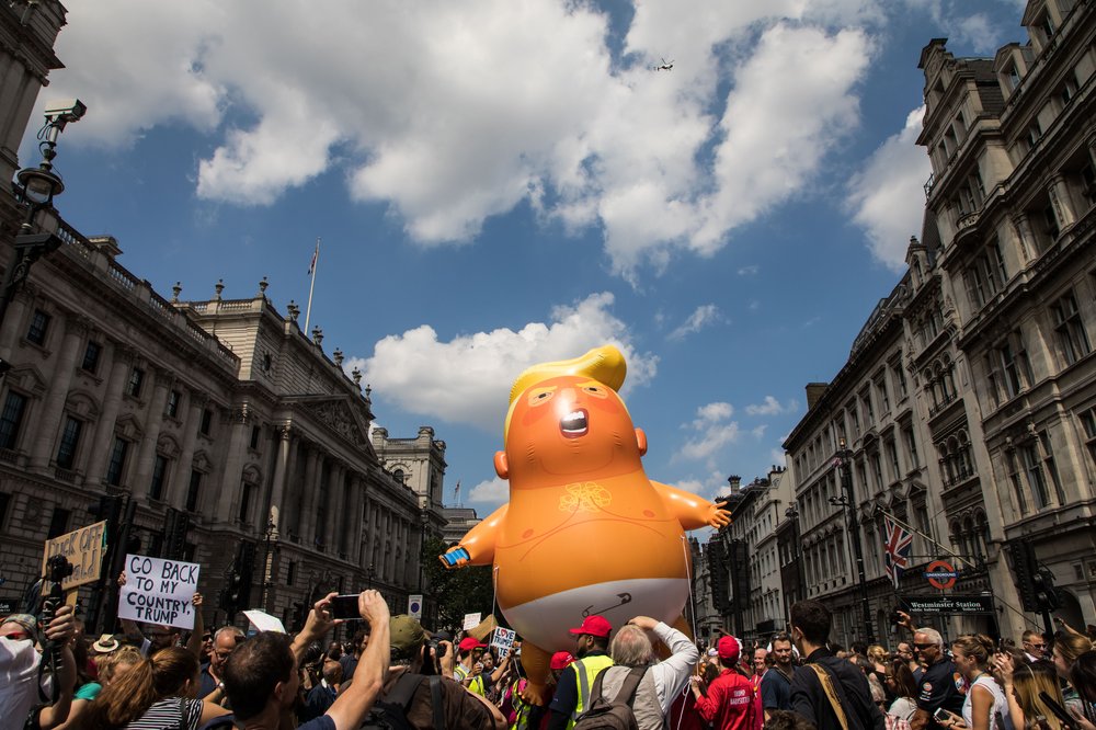 df6e209b7shutterstock_9761045j-jpg.jpeg An inflatable 'Trump Baby' blimp is flown among tens of thousands of protesters gathered in central London to protest the State visit of US President Donald Trump on July 13, 2018 (Vianney Le Caer/Shutterstock)