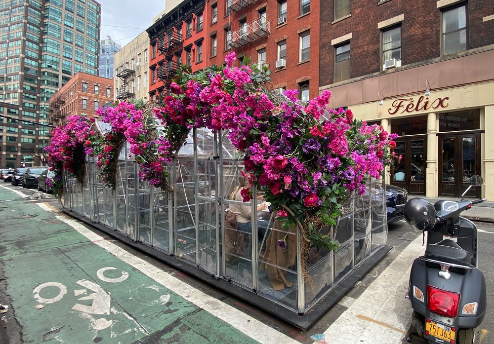 see through outdoor dining tent with flowers
