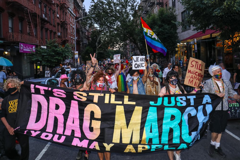 Scenes of men and women participating in the 2020 Drag March through Greenwich Village