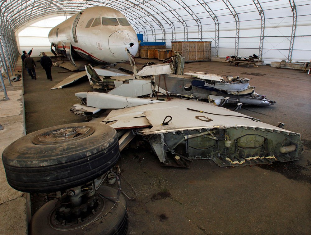 e29dba062shutterstock_6287180f-jpg.jpeg Workers stand near the wreckage of US Airways flight 1549, at a storage facility in Kearny, N.J., as the plane is being prepared to be part of an exhibit after it is moved to an aviation museum in Charlotte, N.C (Mel Evans/AP/Shutterstock)