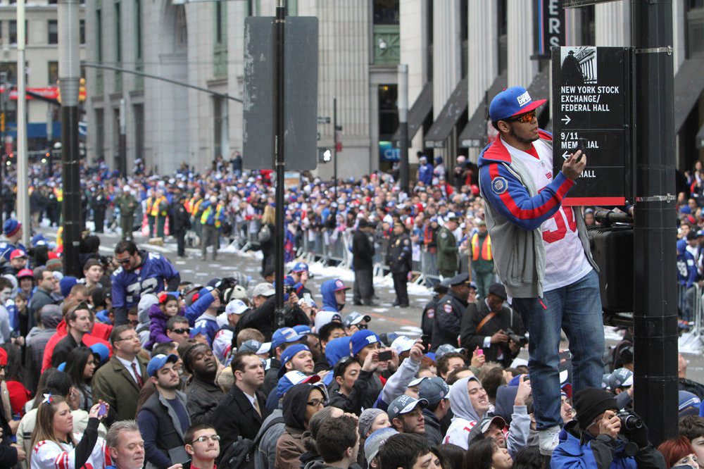 e4532f584shutterstock_6023248b-jpg.jpeg Fans line the street during the 2012 parade for the New York Giants (Mary Altaffer/AP/Shutterstock)