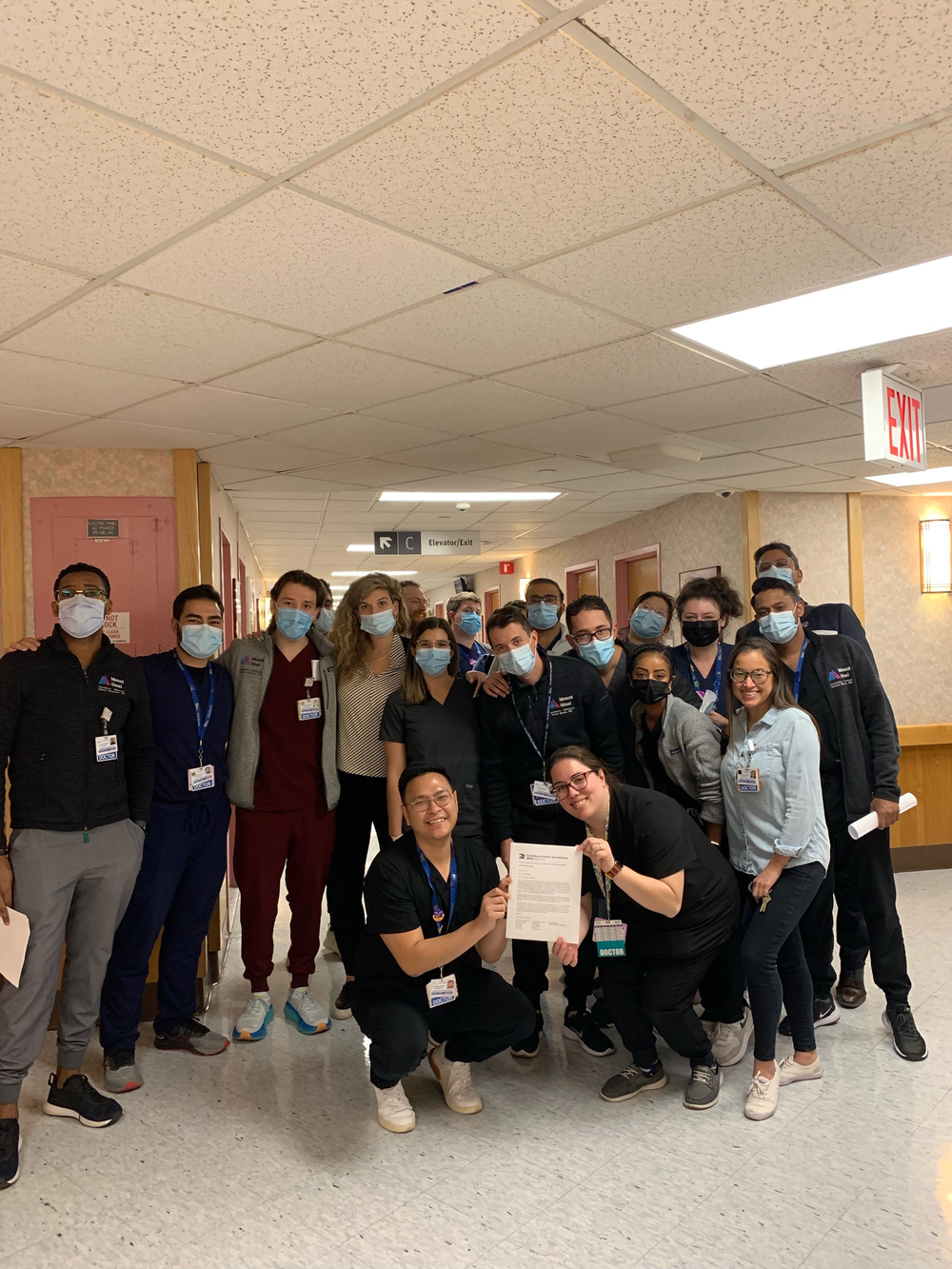 Resident physicians at Elmhurst hospital in Queens prepare to deliver a letter to CEO Helen Arteaga Landaverde urging her to support their call for higher wages.