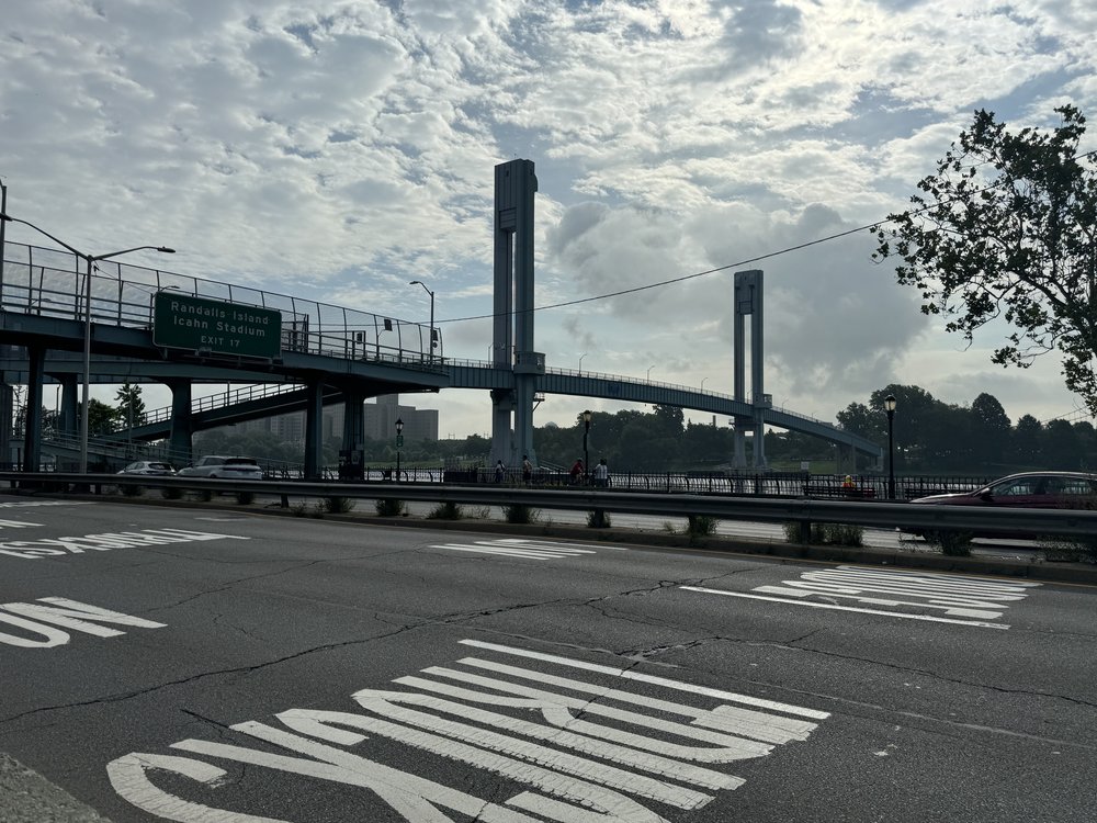The pedestrian bridge spanning the East River, connecting East Harlem to Randall's Island, where more than 2,000 asylum-seekers live in a tent shelter erected by the city.