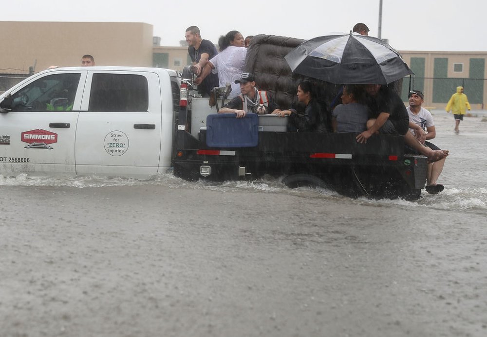 fbf68e1begettyimages-839971210-jpg.jpeg People use a truck to evacuate their homes after the area was inundated with flooding from Hurricane Harvey on August 27, 2017 in Houston, Texas<br>