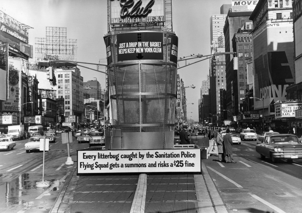 fca352de4.jpeg "A gigantic litter basket in Times Square, New York with a sign saying, 'Just a Drop in the basket keeps new York Clean'. Another sign threatens a $25 fine for any litterbug caught by the Sanitation Police Flying squad. March 1964."