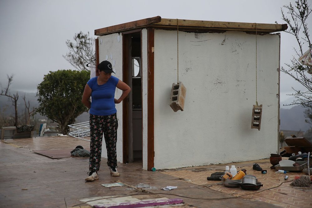 fcedc13ba092517gettypuertorico18-jpg.jpeg Carmen Maldonado walks near the walls of the bathroom which are the only remaining ones in her home in Hayales de Coamo, Puerto Rico on Sunday, September 24th. (Joe Raedle/Getty Images)