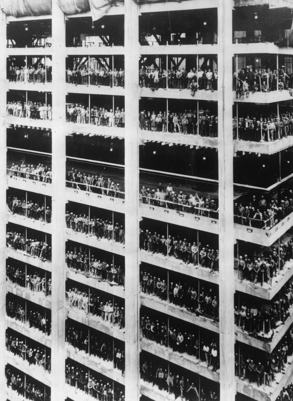 fd191df68.jpeg "3,000 men who helped build the 810 ft high Chase Manhattan Bank in New York City stand in the window spaces of the building near the end of the constructional work. August 1964."