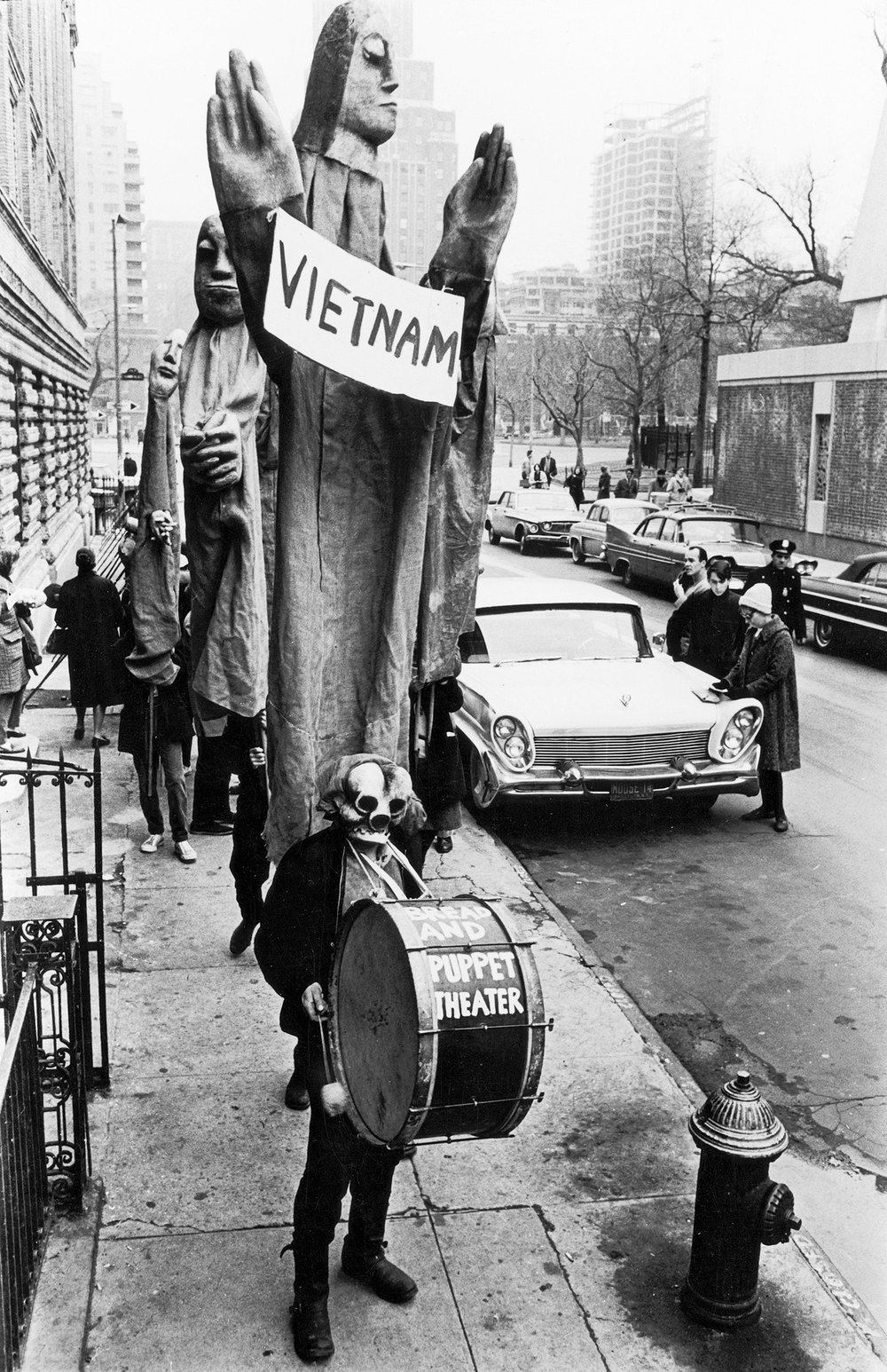 ff432ac72fredwmcdarrah_p119-jpg.jpeg In one of the first protests in New York City against the Vietnam War, masked members of the Bread and Puppet Theater, led by artist, writer, and director Peter Schumann, march down Thompson St. from Washington Square, March 15, 1965<br/>