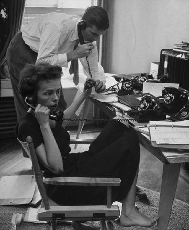 fordmodelingflashback0211.jpg "Ford Modeling Agency co-owners Gerard Ford & his wife Eileen manning 4 telephones at once as they answer call requesting one of their 34 high fashion models in the 3rd floor office."