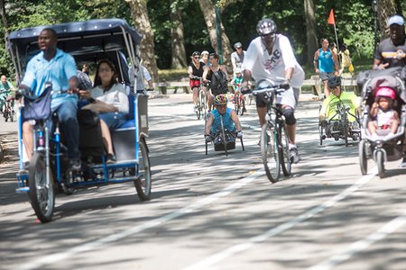 Achilles International holds bi-weekly workouts in Central Park for handcyclists. Cesar Jimenez, left, said riding with a group is crucial, both for safety reasons, and to have someone to chat with. Photo: Skyler Reid