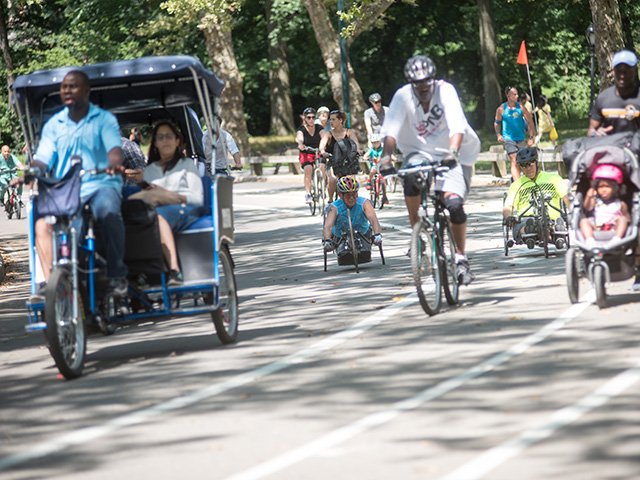 Achilles International holds bi-weekly workouts in Central Park for handcyclists. Cesar Jimenez, left, said riding with a group is crucial, both for safety reasons, and to have someone to chat with. Photo: Skyler Reid