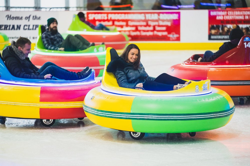 People in ice bumper cars