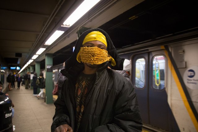 A commuter waiting for one of the noxious gas trains on February 6, 2019
