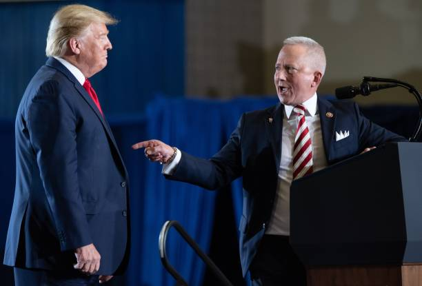 US Representative Jeff Van Drew (R-NJ), who recently switched parties, gestures toward US President Donald Trump during a "Keep America Great" campaign rally at Wildwoods Convention Center in Wildwood, New Jersey, January 28, 2020.