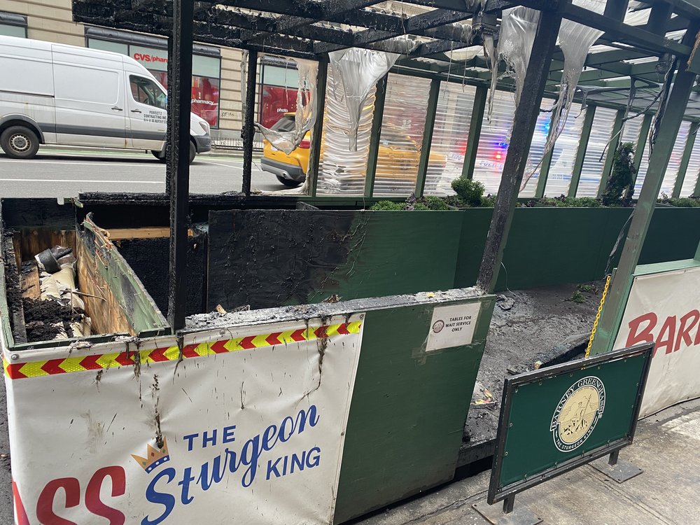 The charred remains of a dining structure outside of Barney Greengrass on the Upper West Side.