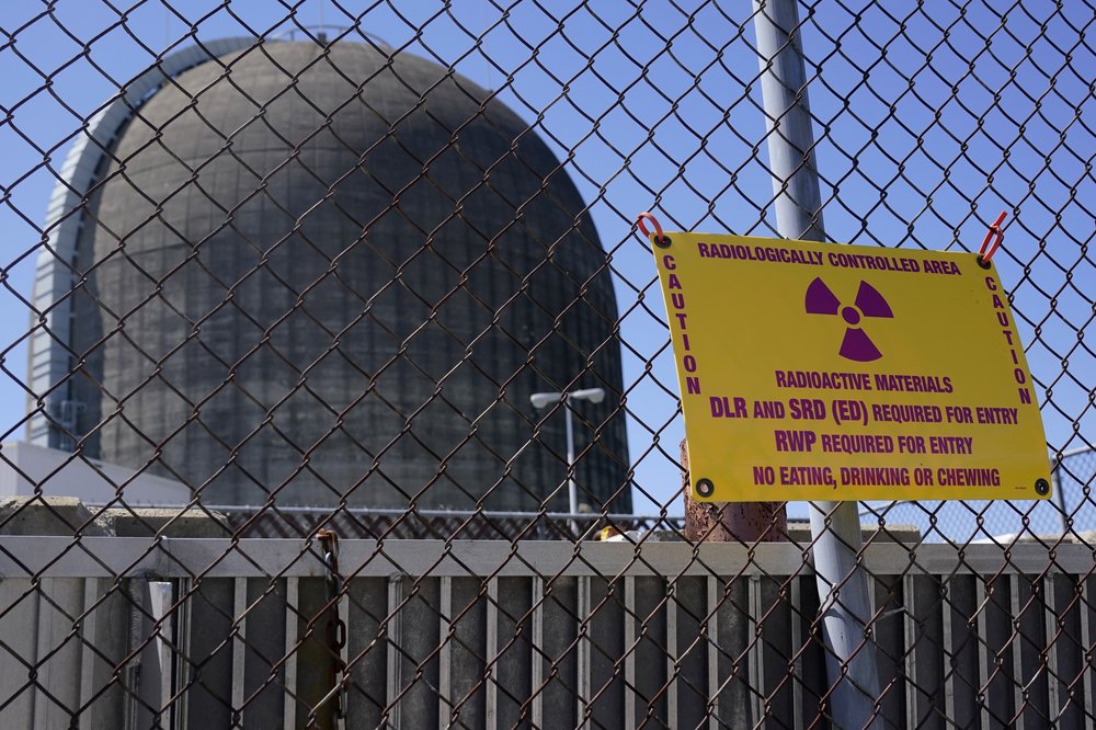 Sign warning of radioactive materials is seen on a fence around a containment building at at Indian Point Energy Center in Buchanan, New York, April 26, 2021.