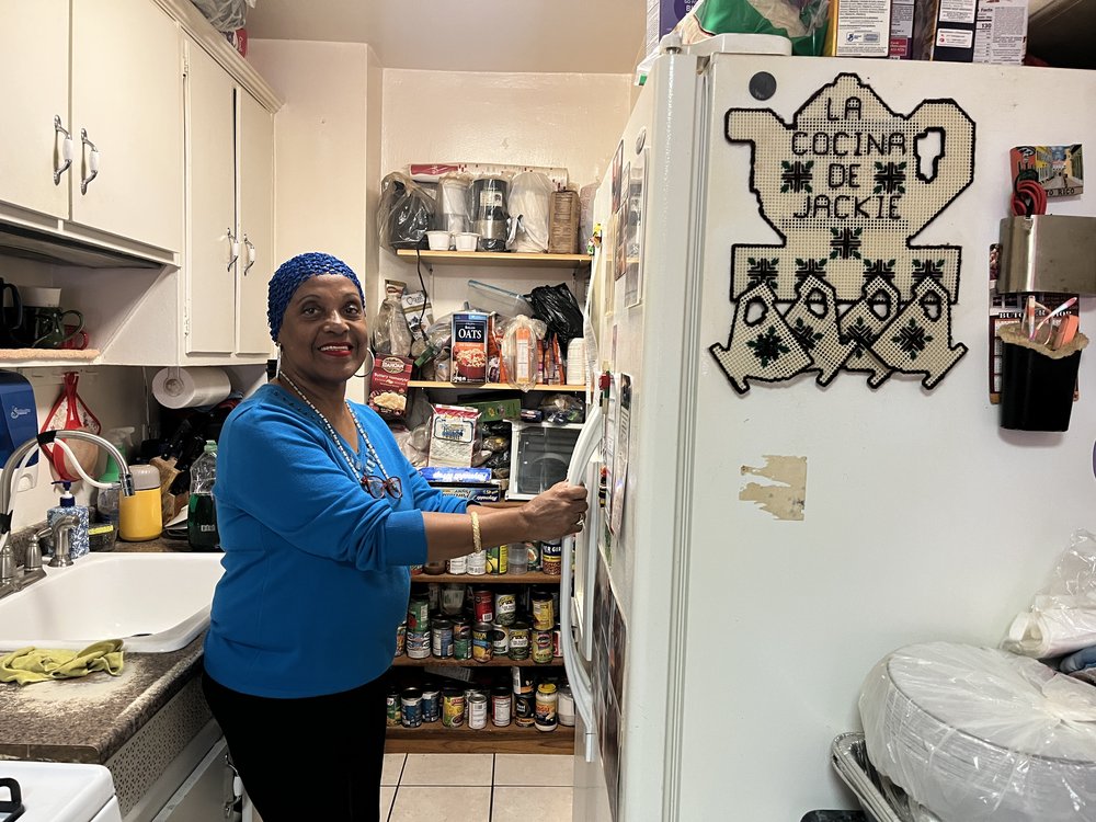 Jacqueline Lopez, 71, puts away food she received from Citymeals on Wheels. She says she hasn’t been able to shop or cook since getting sick a few years ago.