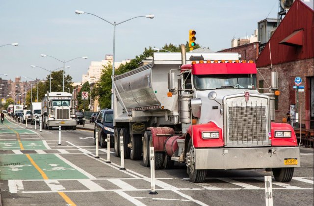 Protected bike lanes are great. But what if they're right next to a bunch of carbon-spewing trucks?
