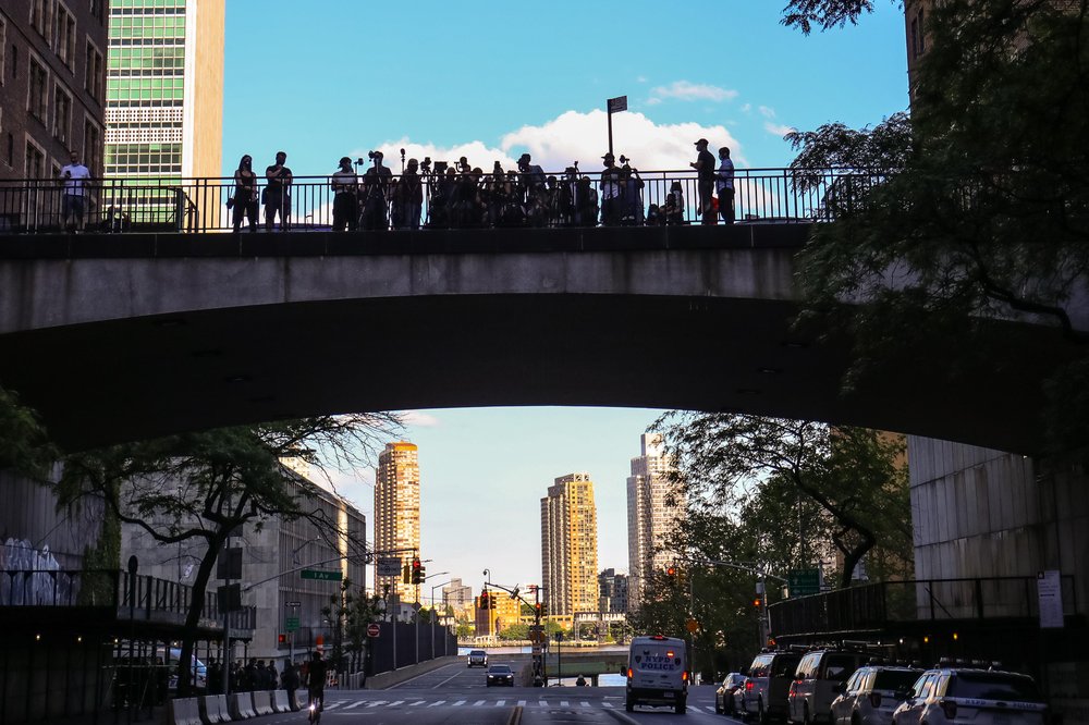 People waiting on the streets of NYC to get photos of the Manhattanhenge event
