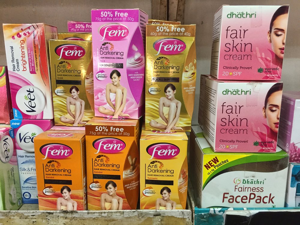 Skin lightening (skin whitening) creams for sale at a shop in Thiruvananthapuram, India.