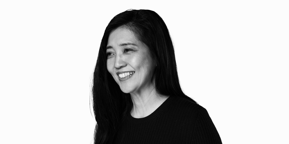 A black-and-white portrait of a woman.