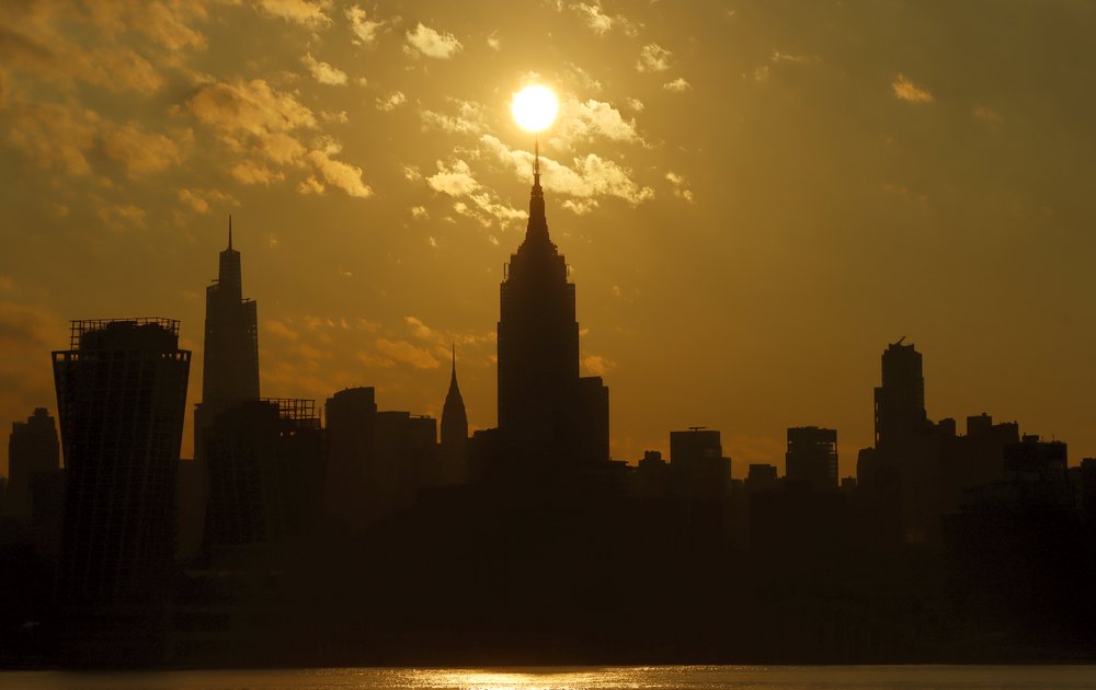 The sun rises above the Empire State Building in New York City on August 4, 2022