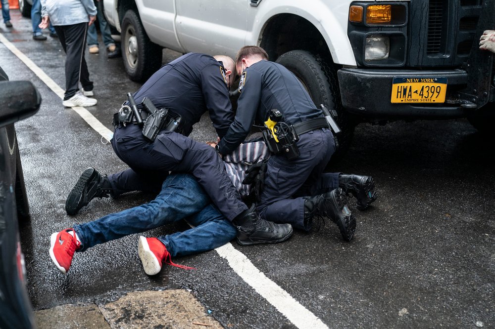 NYPD and FDNY detain a man and place him in an ambulance following a public disturbance on Murray Street in Manhattan, Oct. 13, 2020.