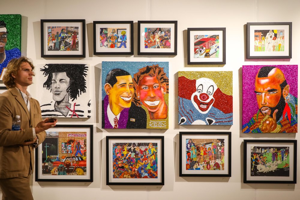 outsider-44.jpg Portraits hang on a wall in rows