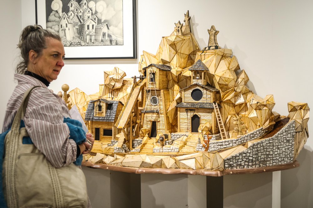outsider-57.jpg A person looks at a sculpture at the Outsider Art Fair
