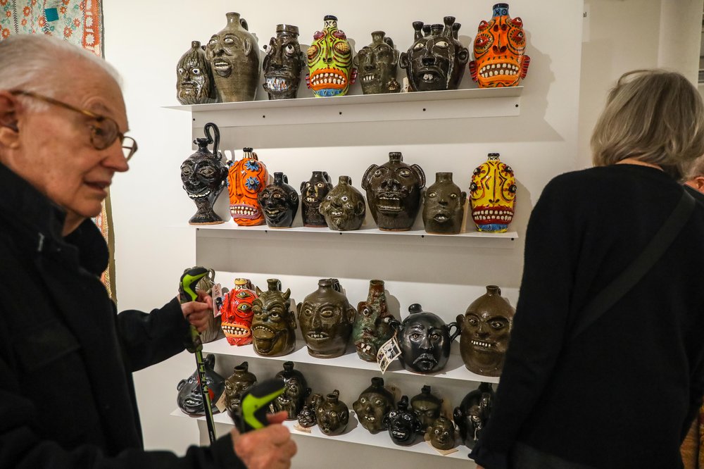 outsider-76.jpg Jugs on a shelf at an art fair