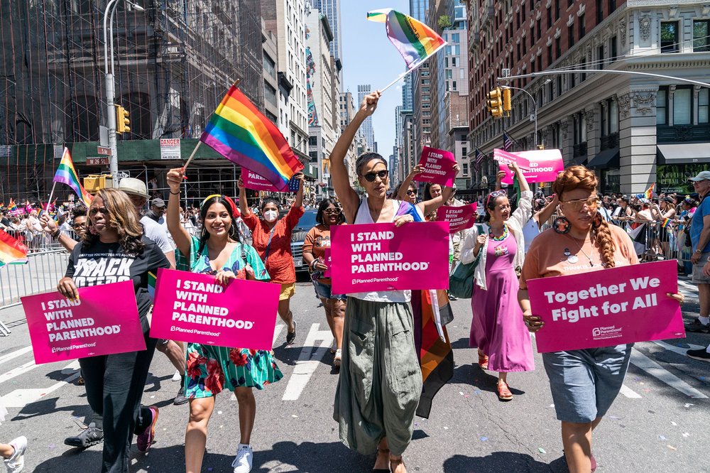 Members of Planned Parenthood and their supporters march during Pride parade on 5th Avenue, June 26, 2022.