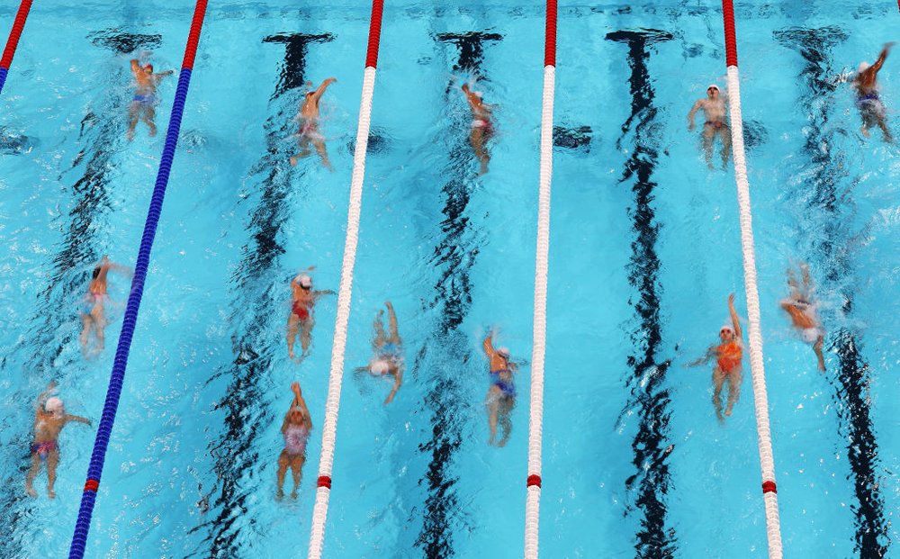 Olympic swimmers practicing in the pool in Paris