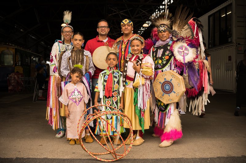 A group of dancers poses for a picture.